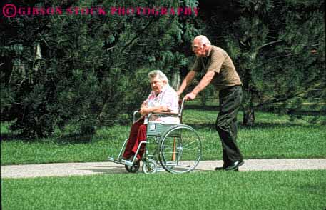 Stock Photo #4458: keywords -  challenge challenged couple disability disabled disadvantage disadvantaged elderly handicap handicapped horz husband impair impaired man mature need needs old push senior share special team together wheelchair wife woman