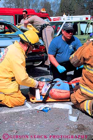 Stock Photo #11873: keywords - accident accidents aid ambulance assist assistance assisting attend auto car collision collisions emergency employee employees fireman firemen first injured injury job jobs man medical medicine men paramedic paramedics public rescue rescuing respond responders response save service technician treat treating treatment uniform vert victim victims work workers working works wreck