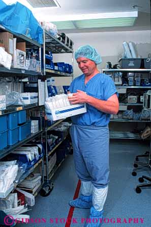 Stock Photo #4479: keywords -  career central clean health hospital inventory job man medical medicine occupation released sanitary service shelf shelves staff sterile supplies supply vert vocation work worker working