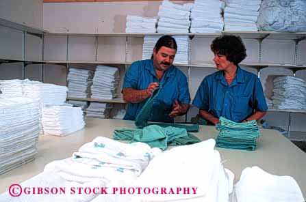 Stock Photo #4482: keywords -  career clean employee employees ethnic fold health hispanic horz hospital housekeeping job laundry learn man medical medicine minority occupation organize race released service staff teach team together train trainee trainer training vocation woman work worker workers