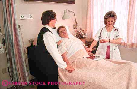 Stock Photo #4488: keywords -  assistance assisting attendant attendants client clients consult discuss examine give giving health healthcare help hold horz hospital medical medicine nurse patient recovery released sister staff steady talk test three treatment woman women
