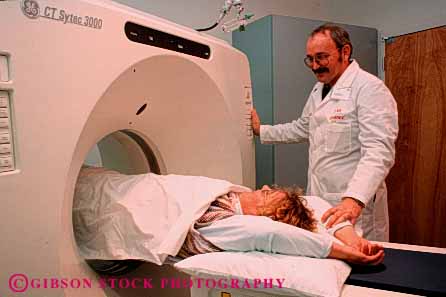 Stock Photo #4491: keywords -  cat examine health help horz hospital male man medical medicine nurse patient recovery release scan staff steady test treatment woman x-ray