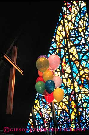 Stock Photo #4495: keywords -  balloon balloons church creed cross denomination divine divinity faith glass god higher holy persuasion power religion religious spirit stained theology vert window worship