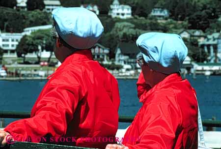 Stock Photo #4511: keywords -  adult child children dress hat hats horz identical jacket look older red same sibling sisters twin twins two women