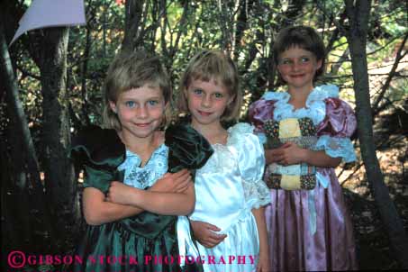 Stock Photo #4512: keywords -  adolescence adolescent child children girl girls horz identical look same sibling sister sisters smile three triplet twins