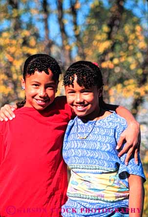 Stock Photo #4514: keywords -  african american black child children cute ethnic girl girls identical look minority pretty race released same sibling sister sisters smile twin twins two vert