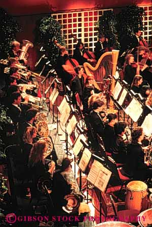 Stock Photo #4520: keywords - art artist cooperate coordinate coordinated create creative group harmony indoor indoors instrument lots many men music musical noise orchestra perform performance play section show sound stage string symphony team together vert women