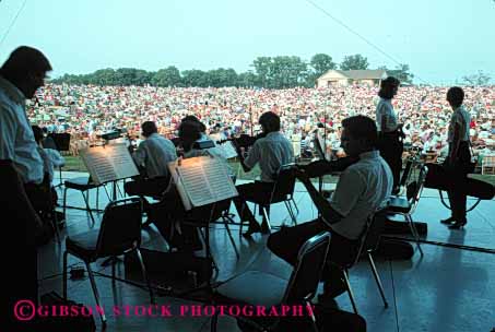 Stock Photo #4519: keywords -  art artist audience cooperate coordinate coordinated create creative group harmony horz instrument lots many men music musical noise orchestra outdoors perform performance play show sound stage symphony team together up warm women