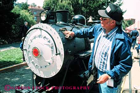 Stock Photo #4537: keywords -  display engine hobby horz little locomotive man miniature model polish railroad replica show small steam toy train working