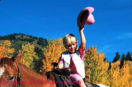 Stock Photo #4590: keywords -  americana child children cowgirl cute five folklore girl horse horseback horseman horz old outdoor outside pretty ranch released southwest tradition traditional west western wrangler year