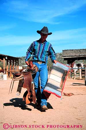 Stock Photo #4591: keywords -  americana career corral cowboy folklore horse horseman job occupation outdoor outside ranch released rough rugged saddle southwest tradition traditional vert vocation west western wrangler