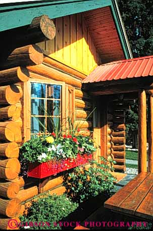 Stock Photo #4596: keywords -  box building cabin construction cute flower home log parallel quaint structure tradition traditional tree vert window wood