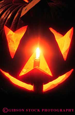 Stock Photo #4639: keywords -  angle autumn candle carve carved face fall flame geometric geometry halloween harvest holiday jack lantern light o orange outdoor outside pumpkin round season silhouette triangle vert