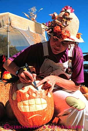 Stock Photo #4642: keywords -  autumn carve carved carving face fall halloween harvest holiday jack lantern o orange outdoor outside pumpkin released round season vert woman