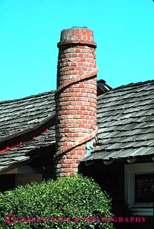 Stock Photo #4647: keywords -  architecture brick building cedar chimney cylinder design fireplace heat hollow home house roof round shake tube unusual vent ventilate vert