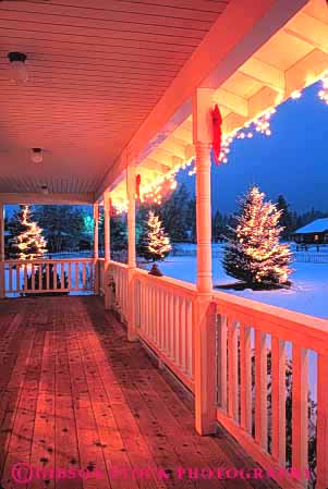 Stock Photo #4652: keywords -  architecture building christmas cold decorate decorated decoration dusk exterior holiday home house lighting lights outdoor outside porch snow sunset vert winter