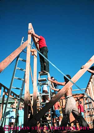 Stock Photo #4674: keywords - add addition assist assistance beam build builder building construct construction cooperate cooperating cooperative elevate frame friend friends group help helping home house improvement ladder lift new owner project raise released residence residential room share team together vert wood