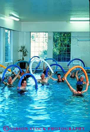Stock Photo #4694: keywords - aerobic aerobics being body class classes condition conditioning elderly exercise exercising group guide heal healing health healthy improve improvement injury learn mature medical medicine old older patient patients people person physical pool professional recover recovering recovery released senior seniors sports swim teach therapist therapy trained treat treating treatment vert water well