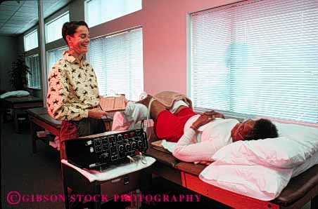 Stock Photo #4697: keywords - african american being black body condition conditioning ethnic guide heal healing health healthy horz improve improvement injury learn measure measurement medical medicine minority patient physical professional recover recovering recovery released sports teach therapist trained treat treating treatment well with woman women