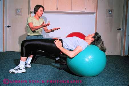 Stock Photo #4701: keywords - back balance ball being body condition conditioning guide heal healing health healthy horz improve improvement injury learn medical medicine patient physical professional recover recovering recovery released sports stretch teach therapist therapy trained treat treating treatment well woman