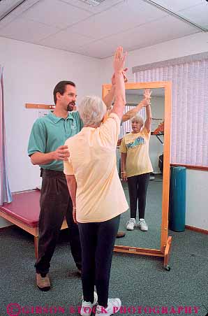 Stock Photo #14647: keywords -  assist assisting assists career condition conditioning exercise exercising flexibility flexible heal healer healing health healthy help helper helping helps hold holding holds job jobs man mirror mirrors patient physical professional recover recovery reflect reflection reflects released routine senior strengthen stretch stretches stretching therapeutic therapist therapy treating treatment treats vert woman work worker workers working workout
