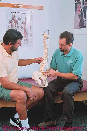Stock Photo #14648: keywords - assist assisting assists backbone career condition conditioning exercise exercising explain explaining explains flexibility flexible heal healer healing health healthy help helper helping helps hold holding holds job jobs male man men model models patient physical professional recover recovery released routine skeleton spine strengthen teach teacher teachers teaches teaching therapeutic therapist therapy treating treatment treats vert work worker workers working workout