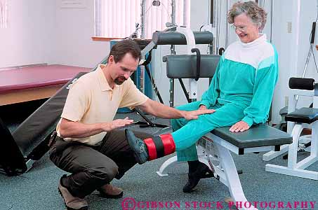 Stock Photo #14650: keywords - assist assisting assists career condition conditioning exercise exercising female flexibility flexible heal healer healing health healthy help helper helping helps hold holding holds horz job jobs leg male man mature old older patient physical professional recover recovery released routine senior strength strengthen therapeutic therapist therapy treating treatment treats with woman work worker workers working workout
