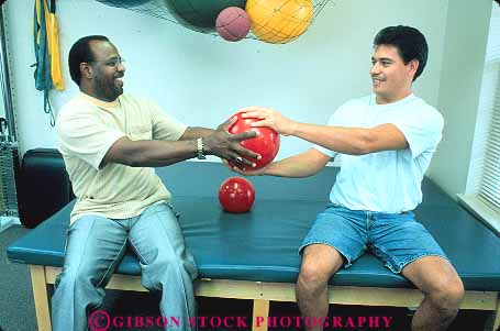 Stock Photo #14849: keywords -  african american ball balls black body client clients condition conditioning conditions ethnic ethnicity exercise exercising heal healing heals health heavy hispanic hold holding holds horz male man medical medicine men minorities minority pair patient patients people person physical recover recovers recovery released share shares sharing team therapeutic therapy treat treating treatment treatments treats two using weight weighted weights workout