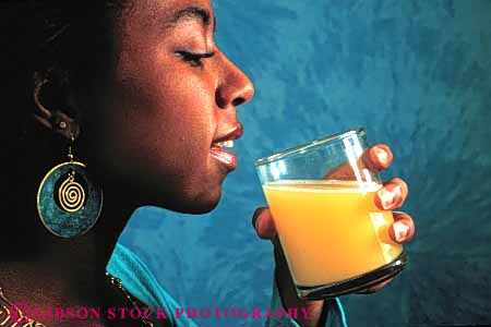 Stock Photo #4710: keywords -  african american beverage black citrus cool drink drinks ethnic fruit glass health healthy horz juice minority nourish nourishment nutrition orange race released woman