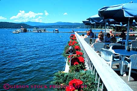 Stock Photo #4711: keywords -  alene cafe coeur dine dining dinner do dock drink drinks eat eating food group horz idaho lake meal outdoor outside patio resort restaurant serve service social summer umbrella umbrellas vacation water