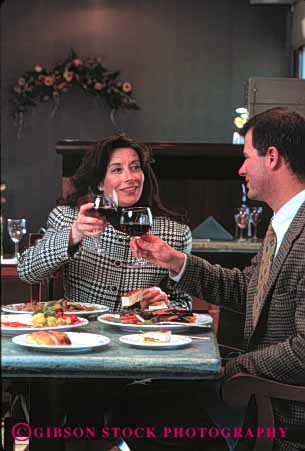 Stock Photo #4717: keywords -  cafe couple dine dining dinner eat eating food group happy meal released restaurant serve service share social toast together vert wine