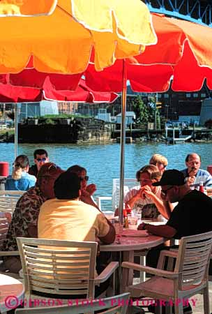 Stock Photo #4718: keywords - cafe cleveland couple couples dine dining dinner eat eating flats food group meal outdoor outside relax restaurant serve service social summer umbrella umbrellas vert