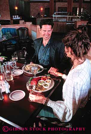 Stock Photo #4720: keywords - affection cafe couple dine dining dinner eat eating food group hands hold intimate meal released restaurant romance serve service share social together vert