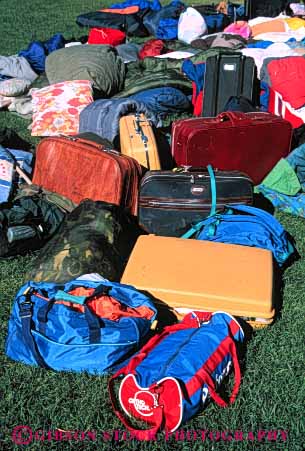 Stock Photo #4726: keywords -  bag clothes clothing contain container disorganized duffel lawn luggage overnight pile sleeping suitcase travel travelers vacation variety vert