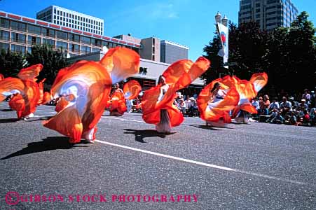 Stock Photo #4737: keywords -  color colorful coordinate coordinated costume costumed dance dancers dancing display dress ethnic festival group horz minority move movement music musical orange oregon parade perform performance performers performing portland practice rose routine show stage street team together traditional