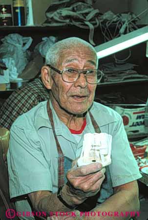 Stock Photo #4768: keywords - alaska american art business carve carving commerce craft craftsman create eskimo ethnic handmade indian jewelry make man minority native nome original product released tradition traditional tribe vert walrus