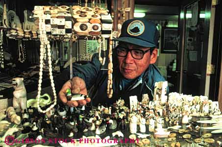 Stock Photo #4775: keywords - alaska american art business buy carve carving commerce craft craftsman create display eskimo ethnic handmade horz indian jewelry make man merchandise minority native nome original product retail sale sell selling tradition traditional tribe walrus