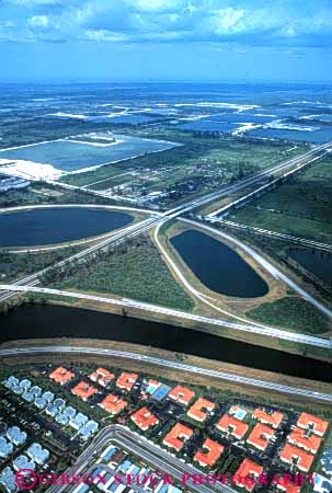 Stock Photo #4809: keywords -  aerial area building city civilization community convert cover development engulf everglades expand florida grow growing growth habitat highway highways houses housing in interchange interstate loss metropolitan miami neighborhood out over sprawl spread take transportation urban urbanization vert wetlands