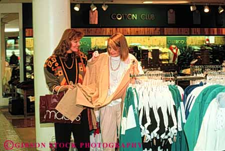 Stock Photo #4823: keywords -  browse business buy buyer clothes clothing commerce consumer customer display economics economy examine female friend friends horz look merchandise purchase purchasing released retail sale see sell share shop shopper shopping spend store talk together two women