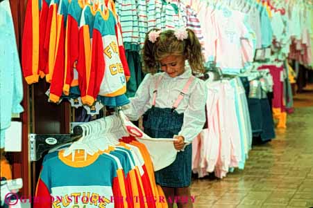 Stock Photo #4826: keywords -  browse business buy buyer child clothes clothing commerce consumer customer display economics economy examine five girl horz look merchandise old purchase purchasing released retail sale see sell shop shopper shopping spend store year