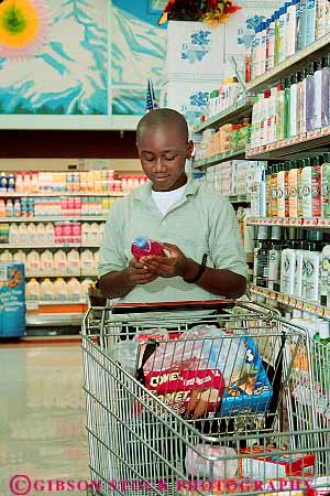 Stock Photo #13682: keywords -  adolescent adolescents african american black boy boys child children customer customers ethnicity label market minorities minority preteen preteens read reader readers reading reads released shampoo shop shopper shoppers shops store stores teen teenage teenager teenagers teens vert young youth