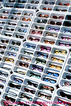 Stock Photo #4843: keywords -  advertise business commerce consume consumerism display economics economy enterprise exhibit glasses grid inventory merchandise merchandising pattern plastic present product products promote retail retailer sale sales sell selling store summer sun sunglasses trade vert