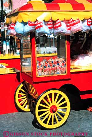 Stock Photo #4868: keywords -  bright business cart color colorful commerce eat economics food little lunch mobile movable one person popcorn portable red retail round sell seller selling serve service small snack vendor vert wagon wheel