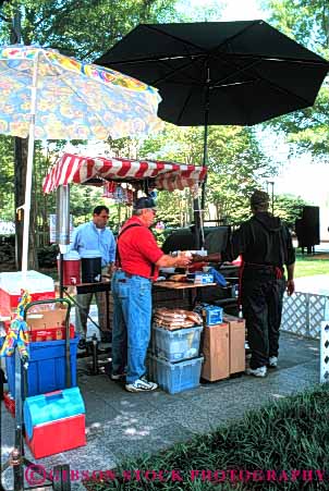 Stock Photo #4870: keywords -  beverage business cart commerce drink drinks eat economics food little lunch man men mobile movable one person portable retail sell seller selling serve service shade small snack umbrella vendor vert wagon