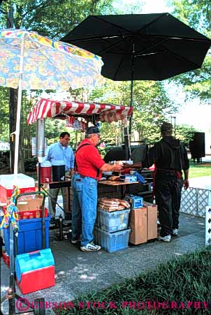 Stock Photo #4870: keywords - beverage business cart commerce drink drinks eat economics food little lunch man men mobile movable one person portable retail sell seller selling serve service shade small snack umbrella vendor vert wagon