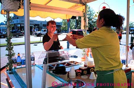 Stock Photo #4873: keywords -  beverage business buyer buying cart commerce cream customer drink drinks eat economics food horz ice little lunch mobile movable one person portable retail sell seller selling serve service small snack summer sweets treat vendor wagon woman women