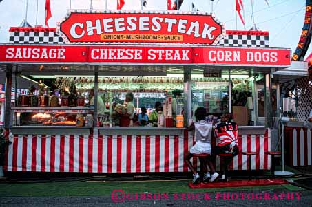 Stock Photo #4876: keywords -  beverage business cart cheesesteak commerce drink drinks eat economics fair festival food horz little lunch mobile movable one person portable red retail sell seller selling serve service small snack trailer vendor wagon