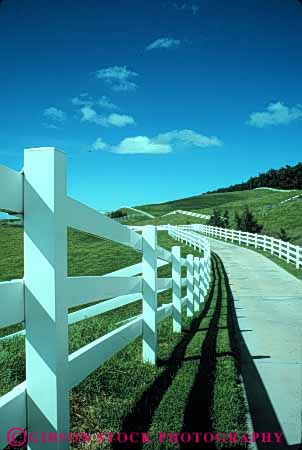 Stock Photo #4878: keywords -  agriculture clean country countryside curve driveway farm fence grass green hawaii horse leading line lines open pasture pavement ranch range rangeland road rural space street vert white