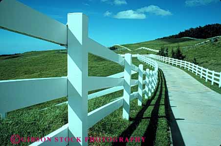 Stock Photo #4879: keywords -  agriculture clean country countryside curve driveway farm fence grass green hawaii horse horz leading line lines open pasture pavement ranch range rangeland road rural space street white