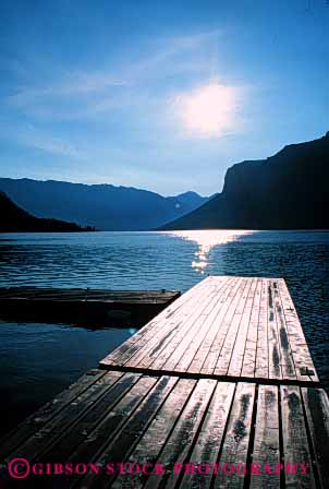 Stock Photo #4908: keywords - alberta banff boat calm dock glare lake landscape minnewanka reflection scenic shore sun vert water wood